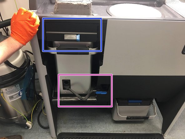 Using two hands, slide the build chamber out of the Fuse, and slide it in to the corresponding area on the Sift
