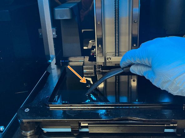 Take a rubber spatula and gently glide along the bottom of the tank. There should be no debris or rough patches.