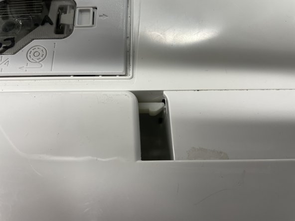 Insert the table into the sewing machine. Make sure all the tabs line up. You should hear a click when it is in.