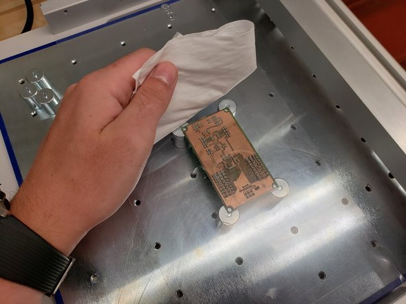 Clean the spreader, plastic shield, and stencil using an IPA wipe.