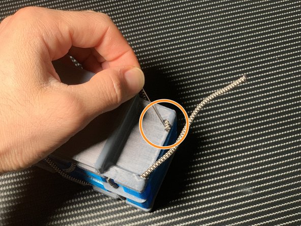 Thread the cord downwards.