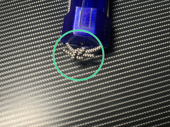 Tie the exposed ends in a loose square knot. Don't tighten it yet!