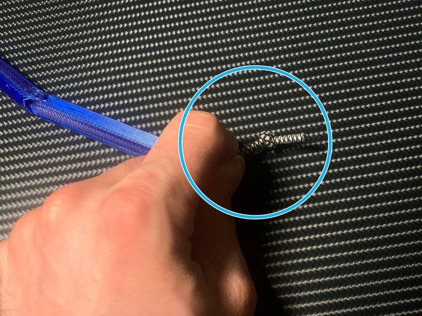 Thread the end segment onto the cord. Note that the cord should poke out of the blunt end, not the spiky end.