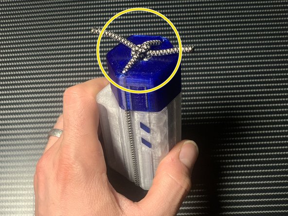 Tighten the knot so the ramrod is held securely, but the toggle is easy to pull away.