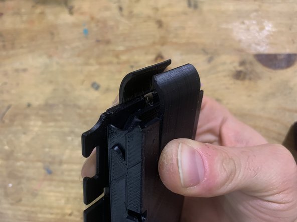 Gently close the magazine up.