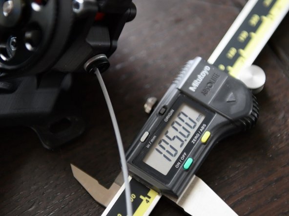 Measure the extruded filament from the extruder. It helps to flush cut this again and measure with the filament straightened out on a flat surface. If you wish to measure from the extruder, just ensure it is straight as possible during measurement.