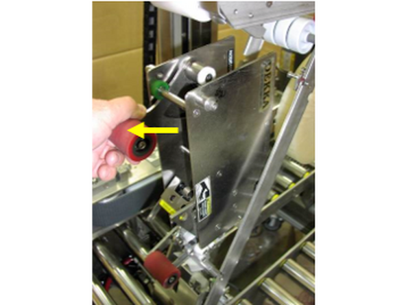 3-On the right side of the holder at the top in the raised position, there is a latch that locks the tape head into the holder. It must be released to remove the head from the holder.