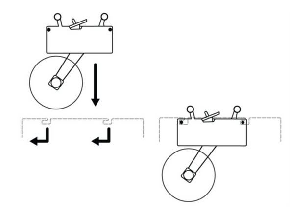 Machines are shipped with the tape head secured in its bracket. To reinstall the tape head, lower them into the brackets to align the pins on their sides with the slots in the bracket.