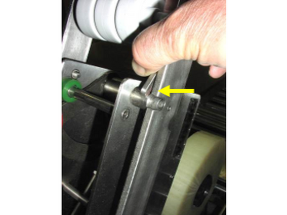 3-On the right side of the holder at the top in the raised position, there is a latch that locks the tape head into the holder. It must be released to remove the head from the holder.