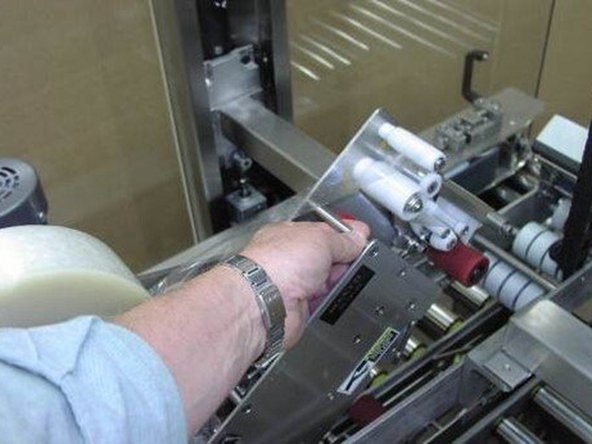 2-On the top tape head, both the front and rear pins head engage in key-shaped slots. Drop the head in and then push it back in its holder to engage in retainer clips.