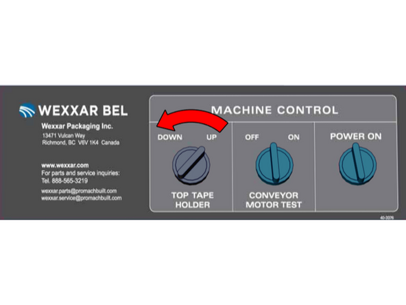 5-Once the tape has been changed or the tape head has been remounted in the bottom holder and the guard doors closed, turn the Tape Holder selector switch to down and push the Reset button to lower the holder back down into the bottom frame.
