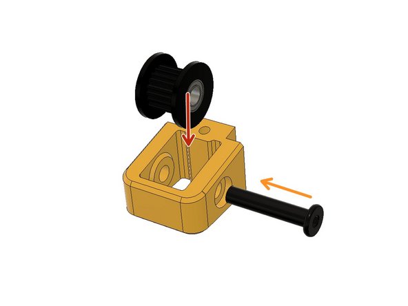 Insert the 9mm toothed idler and hold it aligned with the holes.