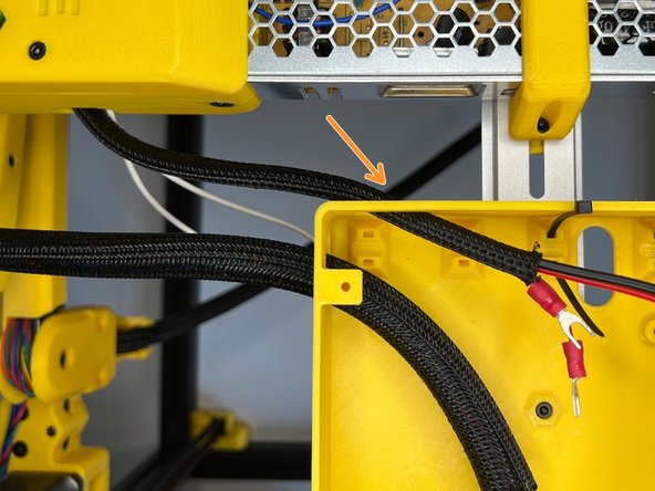 Pass the cables through the hole on the back of the mainboard box.