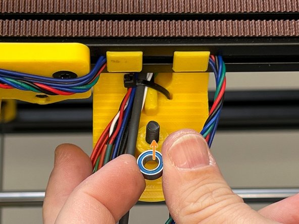 Insert the M5 screw to the centre of the Z Lift Top Holder.  Insert a secondary mr105zz Bearing and prepare for the joint. One bearing behind one bearing front, total 2 bearings for each joint.