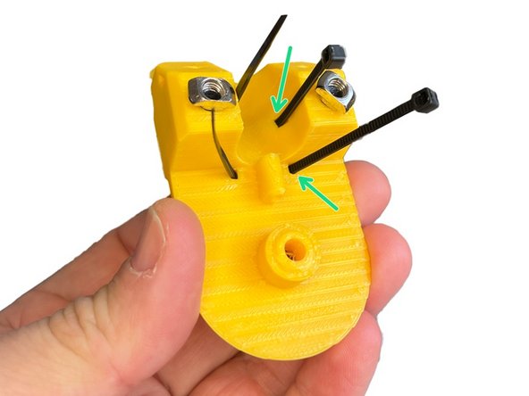 Insert two Zip Ties to the slots on the back.