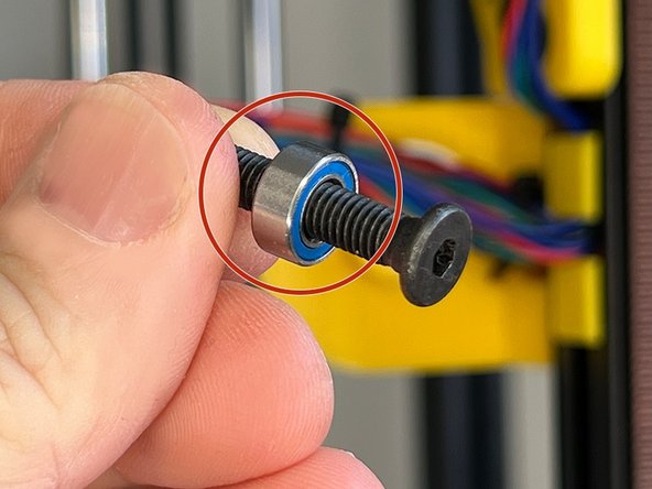 Slide an mr105zz Bearing on the M5 x 25 mm Ultra-Low Head screw.