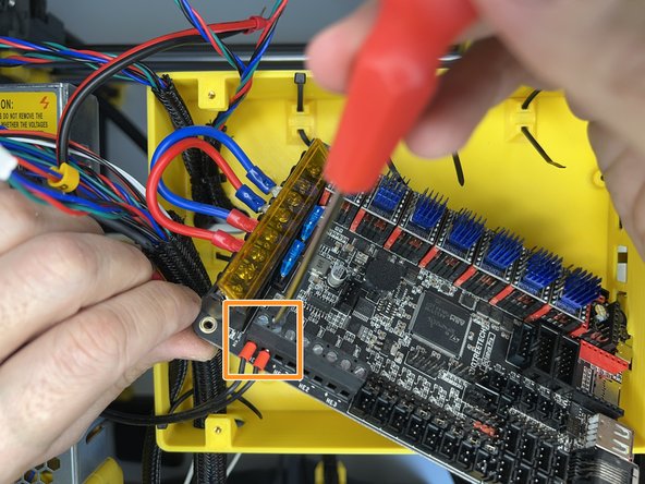 Insert the hotend heater cartridge cables and tighten the flat screws.