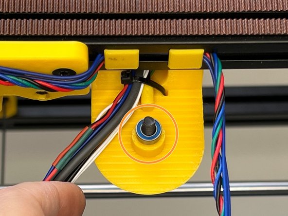 Insert the M5 screw to the centre of the Z Lift Top Holder.  Insert a secondary mr105zz Bearing and prepare for the joint. One bearing behind one bearing front, total 2 bearings for each joint.