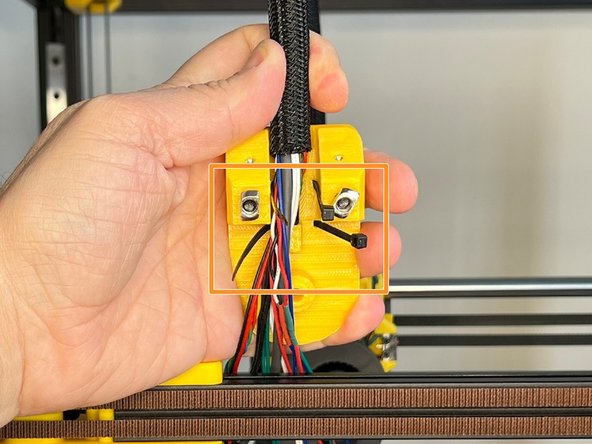 Pass the cables between the zip ties.