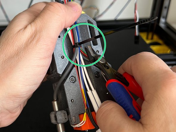 Pass the stepper motor and heatbreak fan cables through the canal.