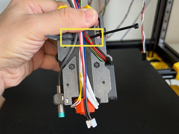 Pass the Inductive Sensor cable through the canal at the back of the extruder body. Ensure to leave some space on the sensor cable to be able to adjust the height of it later.