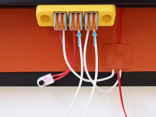 Insert the supplied mains power cable and lift down the orange levers to lock them in place on the WAGO Terminals.