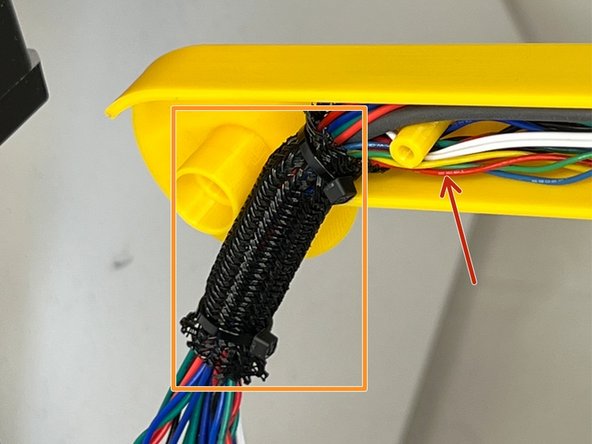 Divide the cable harness equally and tuck them in.