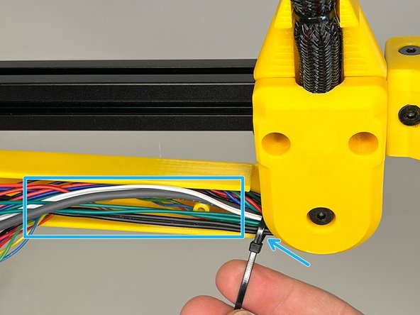 Use a zip tie and tuck in the cable harness by dividing it into two equal portions after the zip tie.