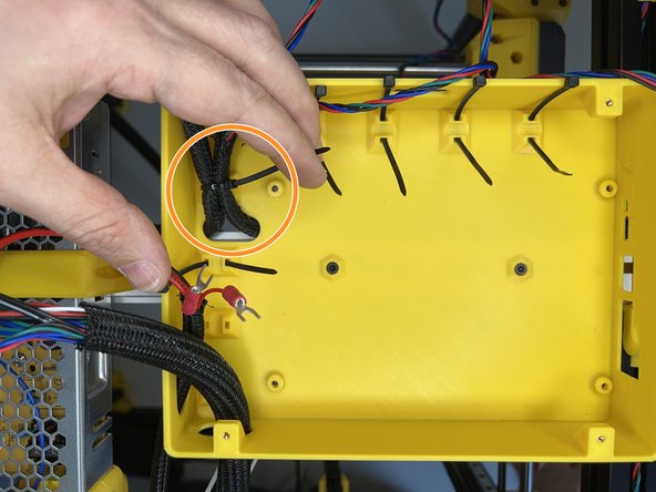 Use the zip tie to fixate the Z motor cables.