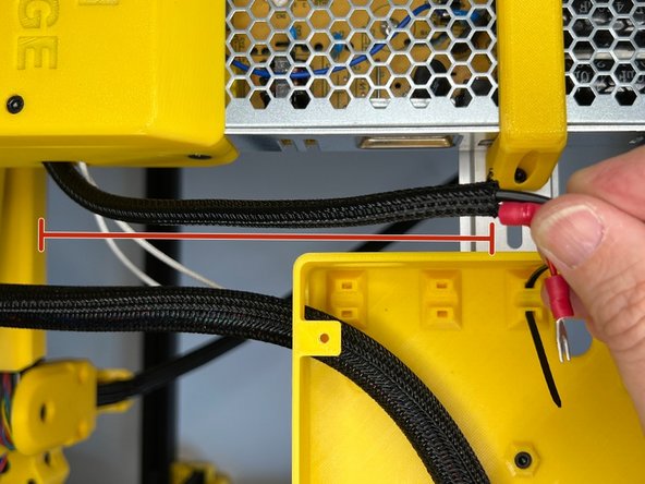 Pass the cables through the hole on the back of the mainboard box.