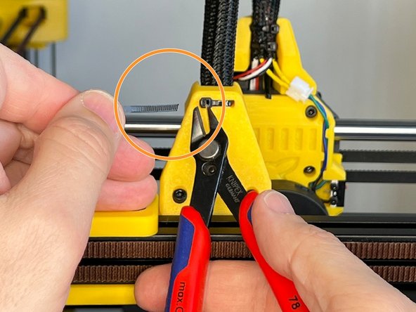 Cut the excess part of the zip tie.