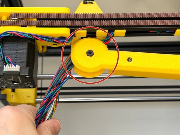 Place the smaller wheel by centring with the M5 screw and tighten the screw. (Tightening a nylock nut will be harder than a regular nut). The bearings will keep the joint fluent and will prevent the screw from loosening in time.