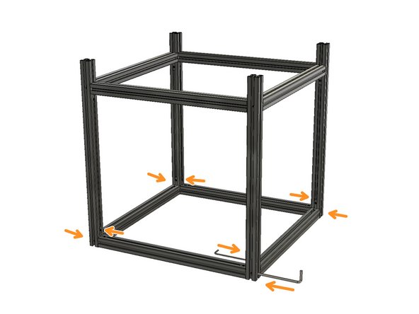Turn the frame upside down on a flat surface. Slide the remaining side extrusions into the 540 mm Z-Axis extrusions back and front. Make sure that the long side of the hidden L brackets is in 460mm side extrusions. The short side of them should be in 540 mm Z-Axis extrusions.