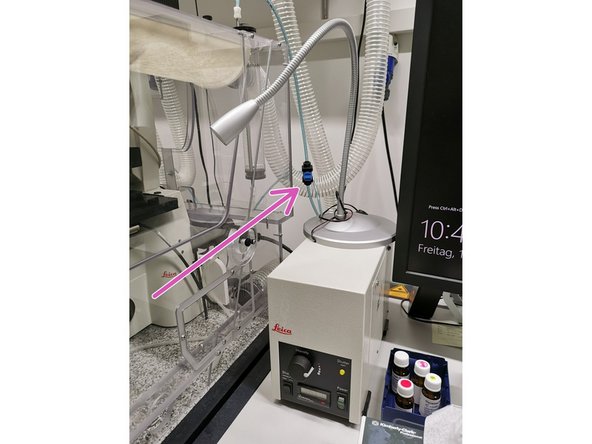 Open the blue valve on the tubing next to the microscope.