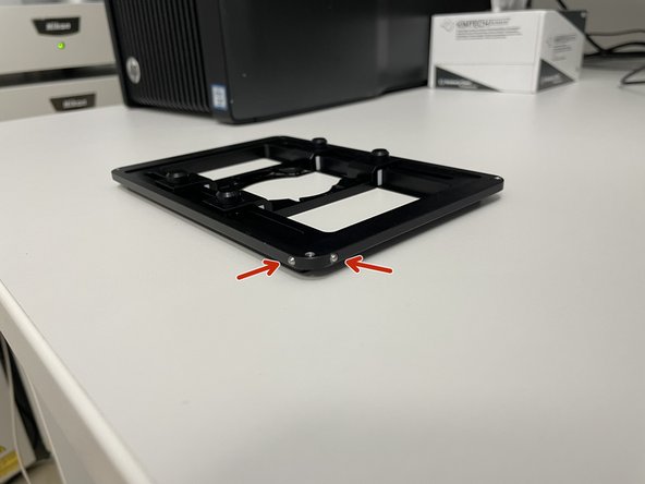 In the universal frame there are two guide pins in one corner, that has to fit first into the top left corner of the stage.