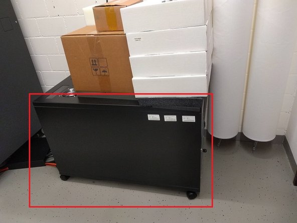 Locate the rack for the K3 computer and power supply at the back of the room.