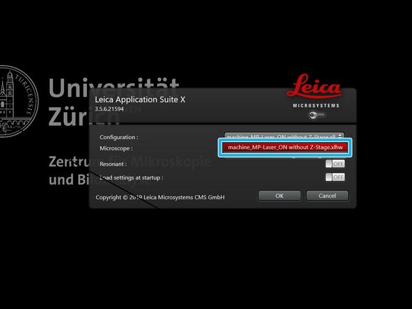 Next open the stage handle and move it away from the objective.