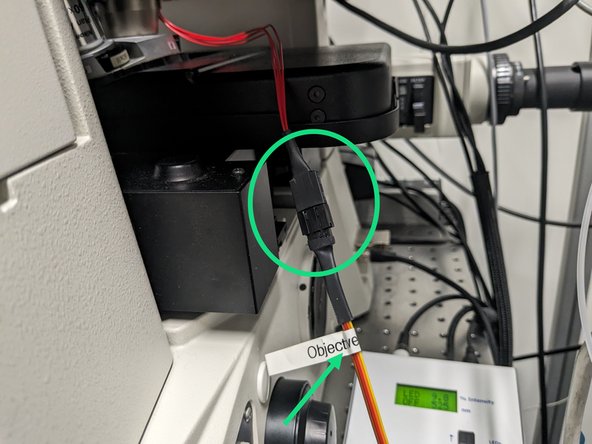 Attach the appropriate cable (labelled with Objective heater.