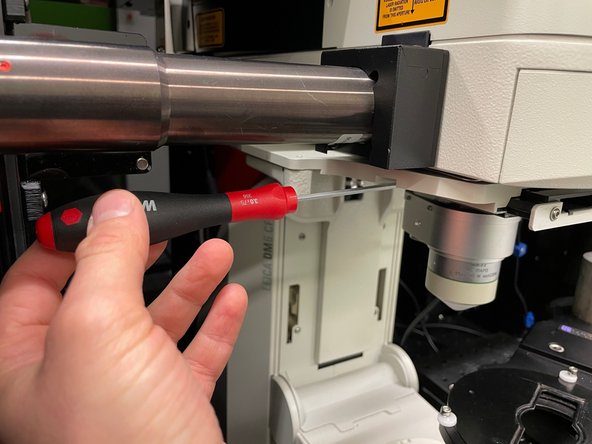 Loosen the screw. This only takes 2-3 turns. Be sure to not completely remove the screw.