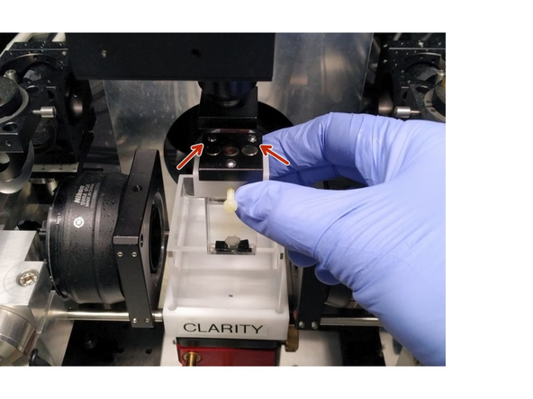 Insert the sample holder with the two two balls to the back.