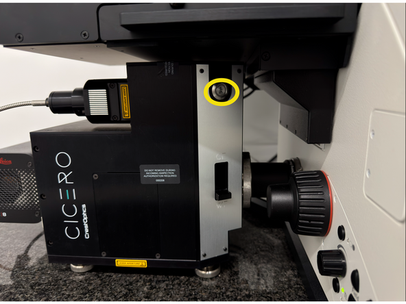 Press the Power/Status button briefly, then turn the laser key from OFF to ON.