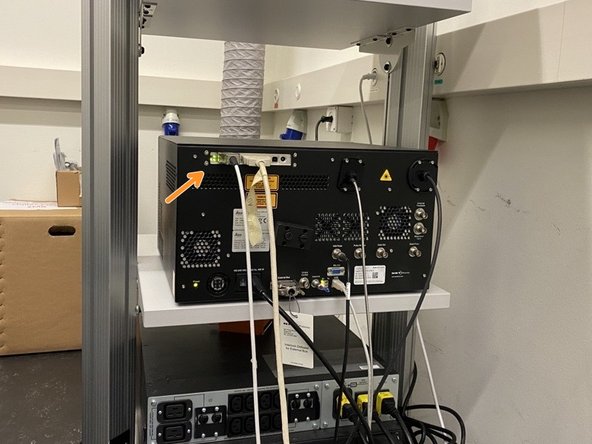 Go to the back of the room and make sure the scanner is ready (green light).