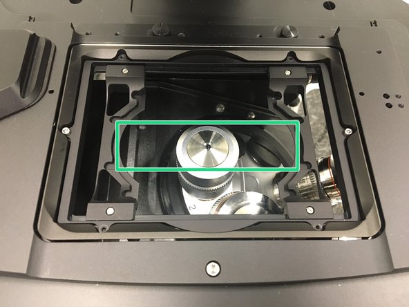 Insert your sample with the coverslip facing down .