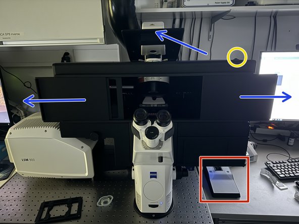 Push back the condenser arm and open the upper doors.