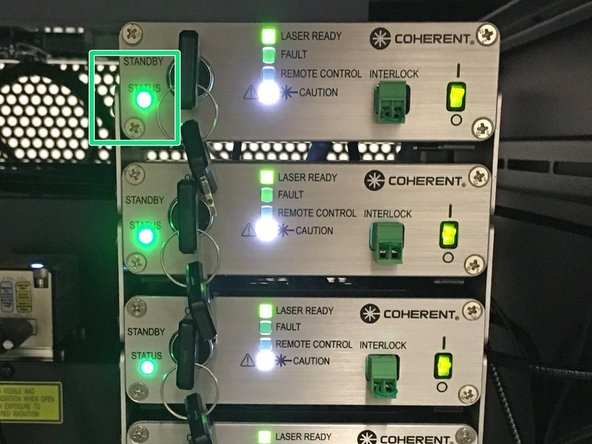 Wait until ALL the laser lights stop blinking.