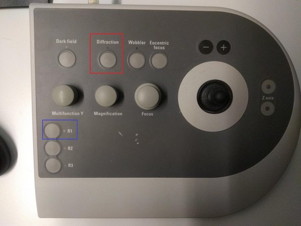 Switch on the diffraction mode on the right microscope control panel.