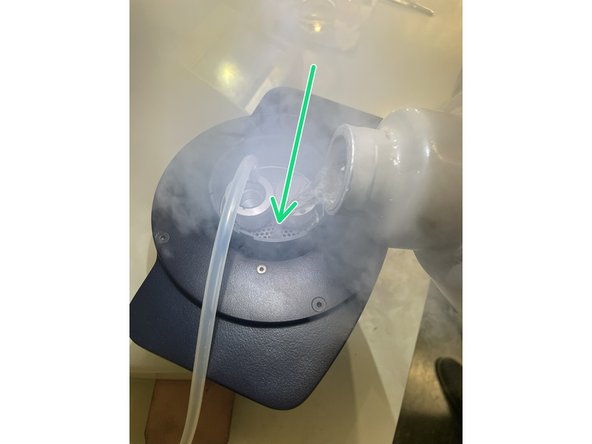 Pour liquid nitrogen into the dewar of the plunge freezer to cool down the system.
