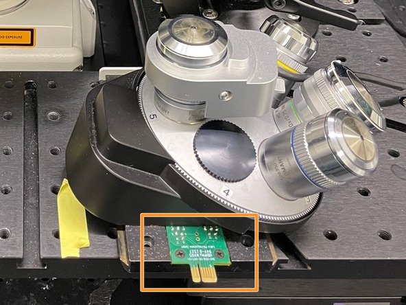 Slide in the objective revolver.