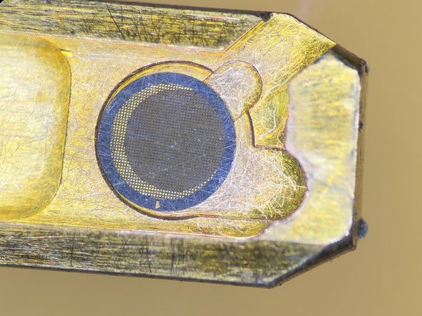 Open the holder clamp with the supplied needle