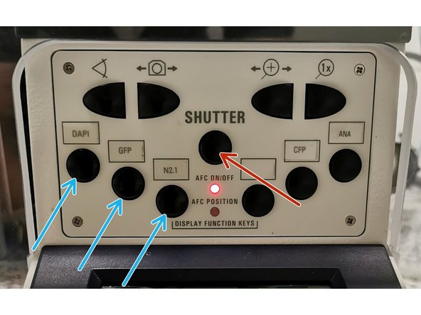 Select a filter which allows you to bring your sample in focus (preferably a bright signal). You should hear a click when the filter is loaded.